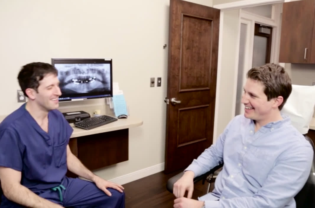 Dr. Fasi having a conversation with a patient